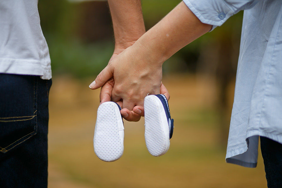 mom and dad holding hands